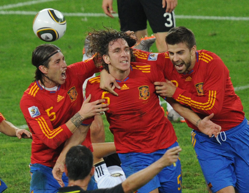 Carlos Puyol scores for Spain in their semi-final against Germany.